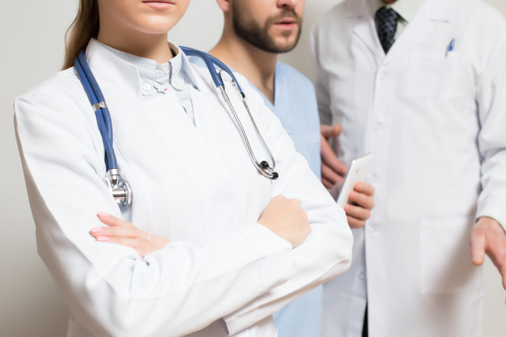 Doctors discussing HIPAA-compliant scheduling software for secure patient appointments