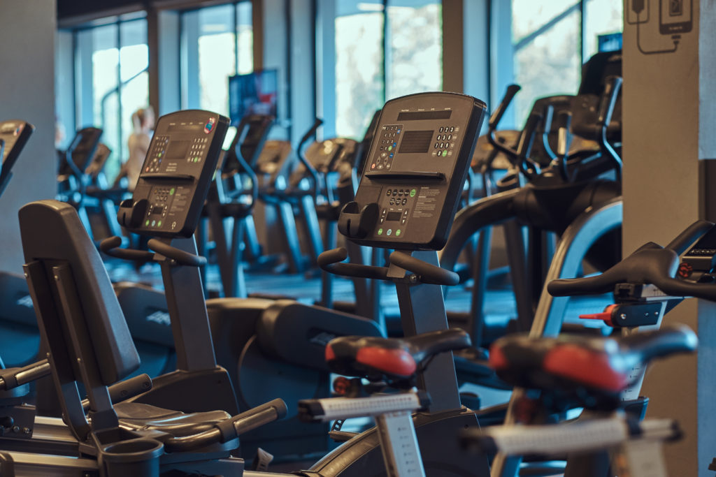 Modern gym with exercise bikes.