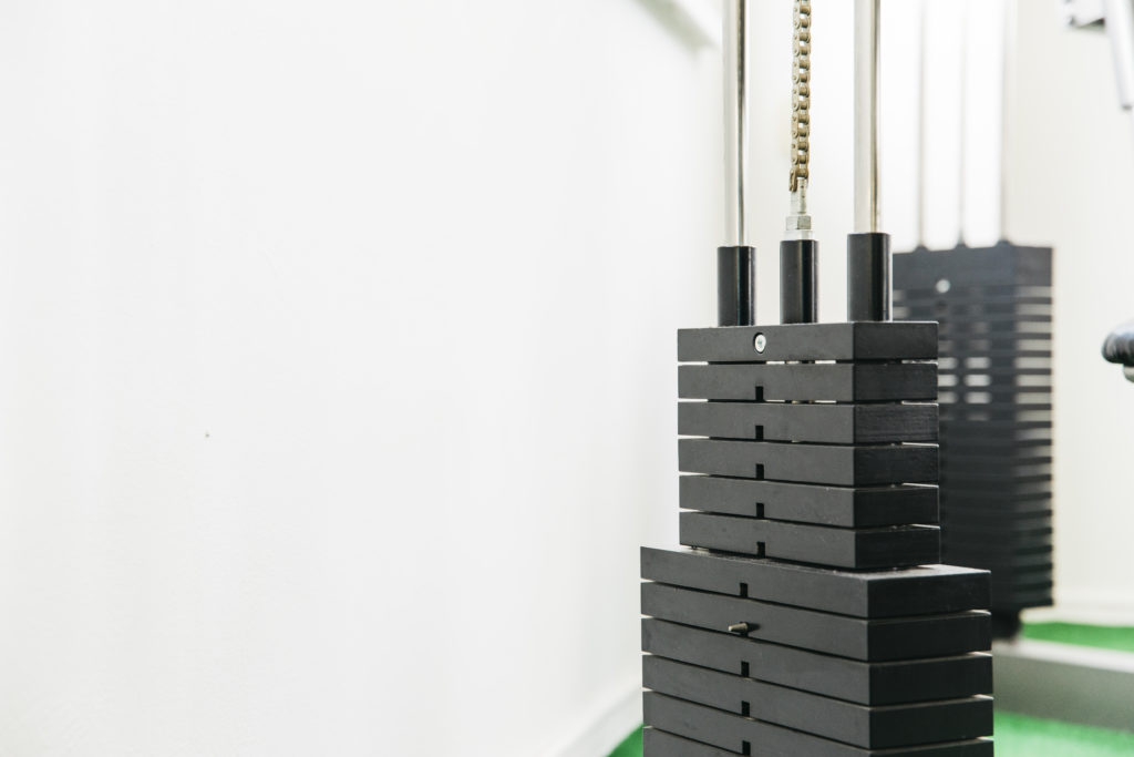 Close-up of gym weight stack representing how membership management tools support fitness operations.